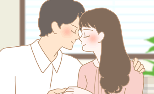 キスする男女